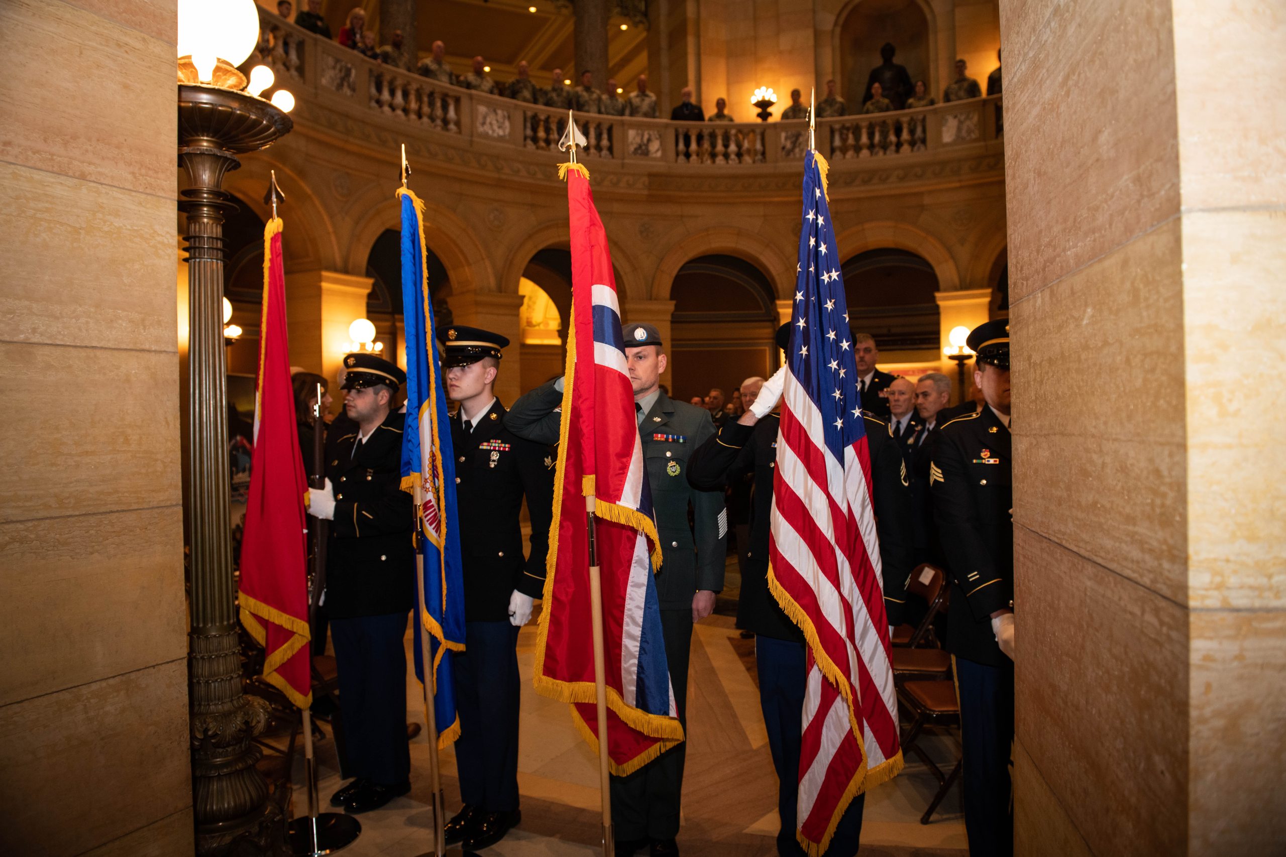 Minnesota National Guard Celebrates 50-Year Exchange with Norway A joint color guard with members of the Minensota National Guard and the Norwegian Home Guard present the colors at the State Partnership Program Letter of Intent signing ceremony hosted by the Minnesota National Guard at the Minnesota State Capitol on Feb. 4, 2023, in St. Paul, Minnesota. The official State Partnership Program signing ceremony is scheduled for Feb.15 in Trondheim, Norway.
The Department of Defense’s State Partnership Program pairs the National Guard of a U.S. state or territory with a partner nation’s military, security forces, and government agencies responsible for emergency response and disaster response and began in 1993 with 13 partners.
The Minnesota Guard has shared a partnership with Croatia for 27 years, and Norway will become another partner through this program. (Minnesota National Guard photo by Staff Sgt. Luther Talks)